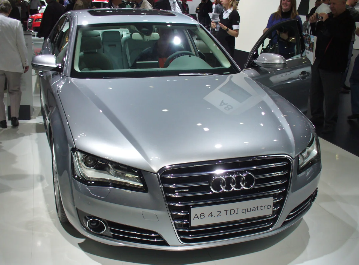 Forged aluminium suspension and driveline components for a passenger vehicle