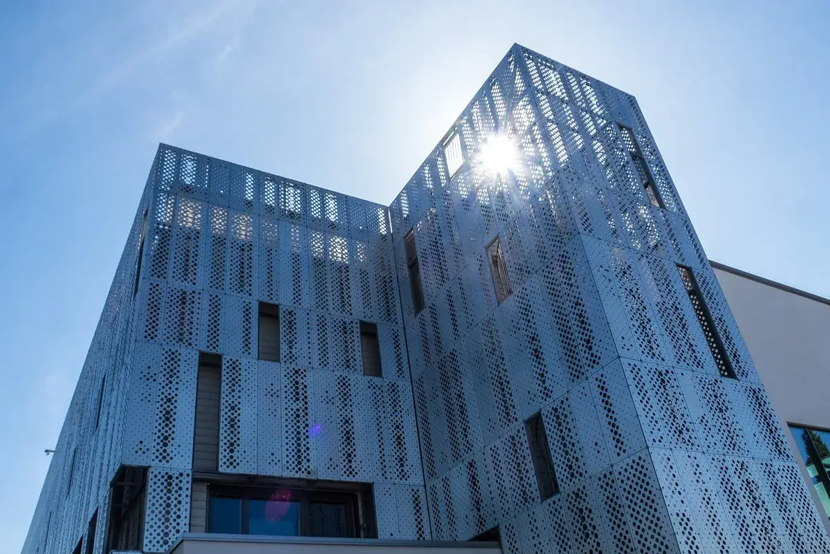 Building clad in perforated aluminium panels